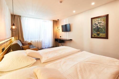 En eller flere senge i et værelse på Resort Sněžné AMANITA