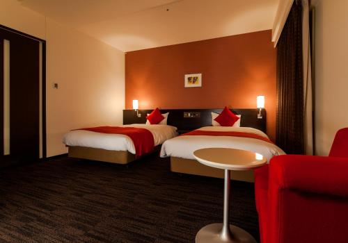 Säng eller sängar i ett rum på Daiwa Roynet Hotel Okayama Ekimae