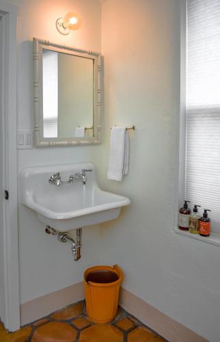 a bathroom with a sink and a mirror at The Parador in Santa Fe