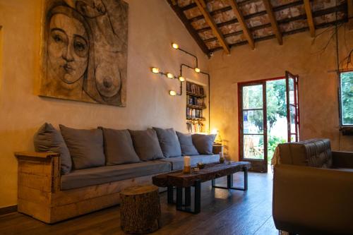 a living room with a couch and a table at Pura Vida Mae YerbaBuena in Yerba Buena