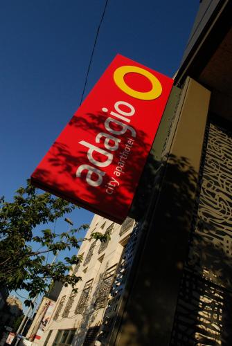 a red sign on the side of a building at Aparthotel Adagio Bordeaux Centre Gambetta in Bordeaux