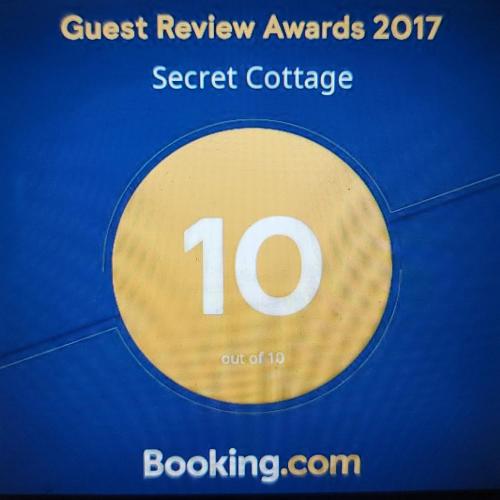 a sign that reads guest review awards secret conference at Secret Cottage Yellowstone 1 bd 2 beds dtwn #1 in Cody