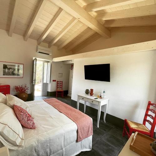 Ένα ή περισσότερα κρεβάτια σε δωμάτιο στο Massidda Country Retreat