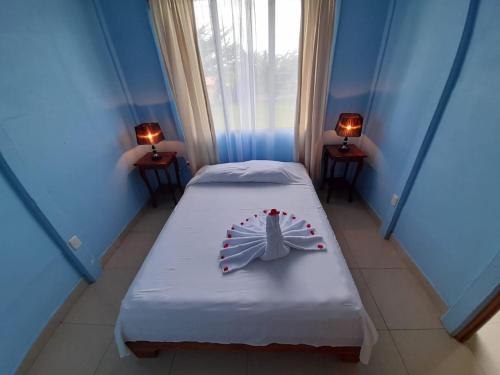 Posteľ alebo postele v izbe v ubytovaní Casa de Campo Heliconia