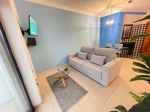 a living room with a couch and a table at Miguel Torga River in Coimbra