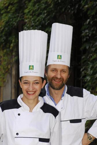 two chefs standing next to each other in chefs hats at Logis Hostellerie Du Grand Duc hôtel restaurant in Gincla