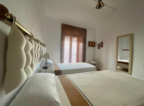Ένα ή περισσότερα κρεβάτια σε δωμάτιο στο La Casa 5