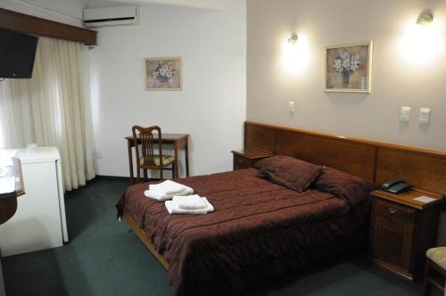 Säng eller sängar i ett rum på Hotel Hoxon
