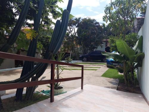 a porch with a hammock and a cactus at Chalés Paraiso de Pipa in Pipa