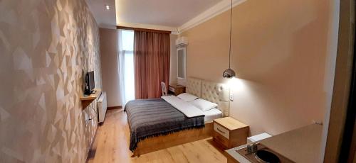 Postel nebo postele na pokoji v ubytování Happy Stay Hotel