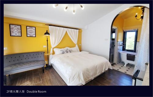 a bedroom with a bed and a sink and a tub at Top Sunlight Inn in Xiaoliuqiu