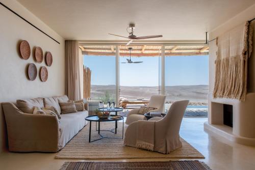 a living room with a couch and a table at Six Senses Shaharut in Shaharut
