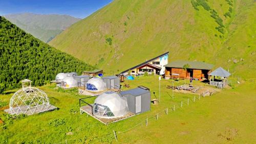 an aerial view of a group of tents in a field at Zeta Camping in Jut'a