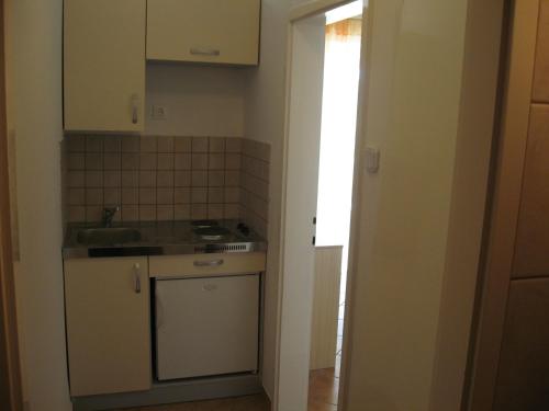Kuchyň nebo kuchyňský kout v ubytování Shell Bay Apartments