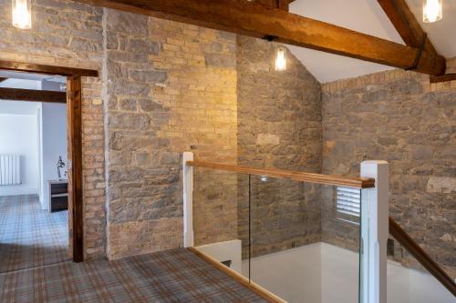 a staircase in a room with a brick wall at Markree Courtyard in Collooney