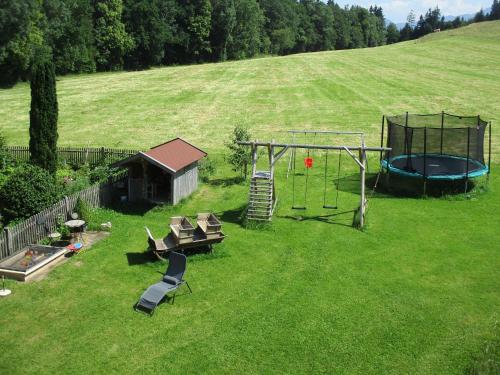 an aerial view of a backyard with a trampoline and a trampoline at Agelbauer in Irschenberg