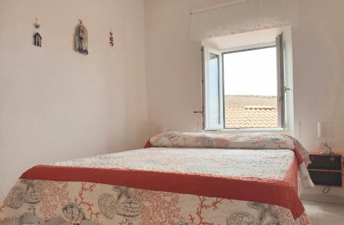 Кровать или кровати в номере alcastello - Casamatta via Dante Alighieri,36