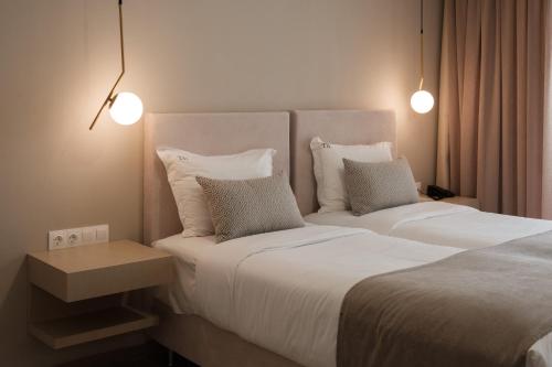 Postel nebo postele na pokoji v ubytování TEREZAS HOTEL