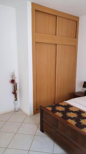 Ένα ή περισσότερα κρεβάτια σε δωμάτιο στο Santana single bedroom serviced apartment