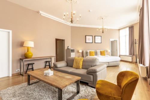 a living room with a couch and a bed at House of Bruges in Bruges