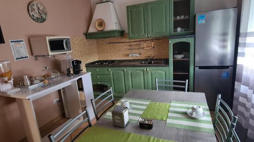 Kuchyň nebo kuchyňský kout v ubytování B&B Regina
