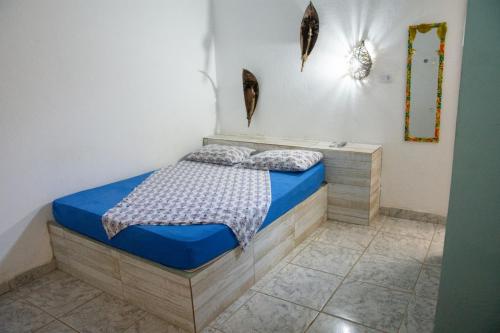 Ένα ή περισσότερα κρεβάτια σε δωμάτιο στο Pousada da Vivi