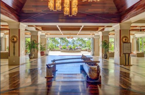 a large lobby with a table and chairs in it at 2 Bedroom OCEAN VIEW LUXURY resort condo with extra large balcony in Lahaina