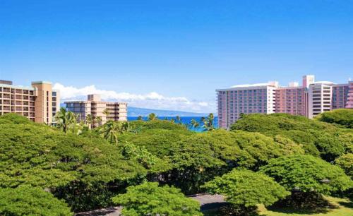 a bunch of trees in front of some buildings at 2 Bedroom OCEAN VIEW LUXURY resort condo with extra large balcony in Lahaina