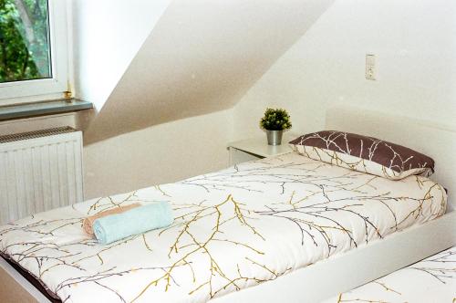 a bed in a white room with at Liva Apartments Herne in Herne