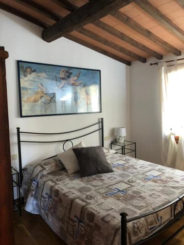 Ένα ή περισσότερα κρεβάτια σε δωμάτιο στο Casale Giocondo