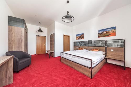 Postel nebo postele na pokoji v ubytování Hotel Mariánský Dvůr
