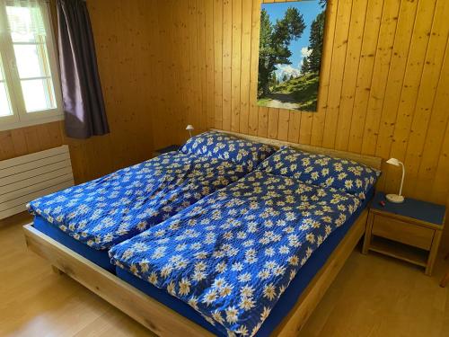 Tempat tidur dalam kamar di Chalet Herrschaft