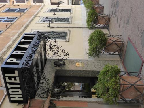 an apartment building with a balcony with a piano at Hotel Prati in Rome