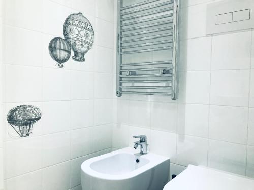 a bathroom with a sink and a toilet and balloons at La Palladiana - Immobilevante in Ponza