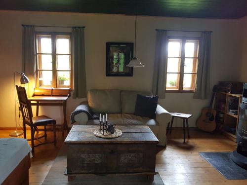 a living room with a couch and a coffee table at Berghütte Fürstenwalde in Fürstenwalde