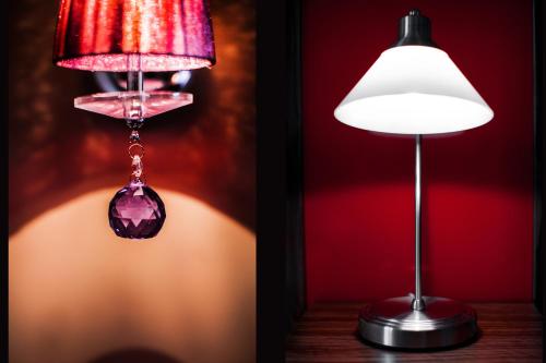 a lamp and a lamp shade with a gemstone hanging from it at Apartament Podwale in Łańcut