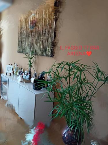 a room with a desk and plants on the wall at Il Faggio 17 B&B in Artena