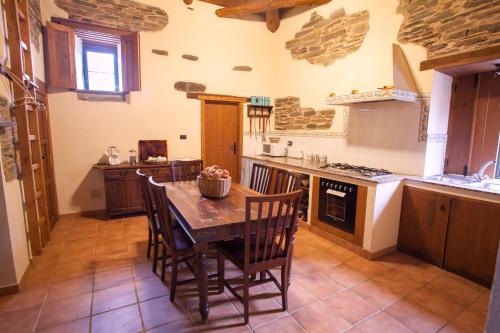 a kitchen with a table and chairs in a room at CASA XAYMACA in Samos