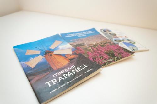 a book about a windmill and a farmers magazine at La Dimora Di Segesta B&B in Calatafimi