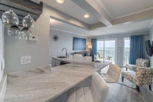 a kitchen with a large counter and a living room at 421-Fully renovated, WIFI, Pool, Amazing Views, Near BUCS Stadium in Tampa
