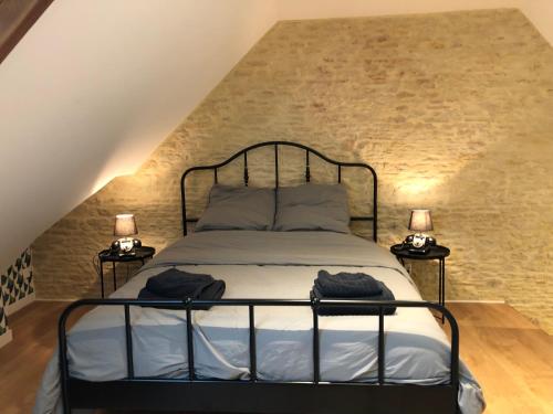 En eller flere senge i et værelse på Maison de pêcheur de 1820 au cœur du bourg - 3 étoiles