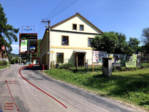 a yellow house on the side of a road at Chata Větrník u Černého dolu v Krkonoších in Lauterwasser