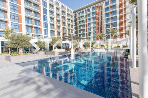 an image of a swimming pool in a building at Staycae Holiday Homes - Celestia in Dubai