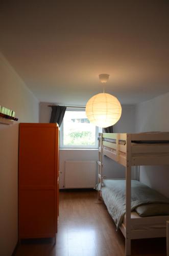 a bedroom with a bunk bed and a lamp at Lavaux 60 in La Roche-en-Ardenne