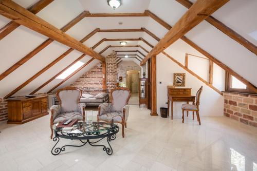 a living room with a table and chairs at Hotel Villa Duomo in Kotor
