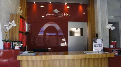 a counter in a store with a sign that says dance liked me at Hotel Spa Pinar del Mar in Platja  d'Aro