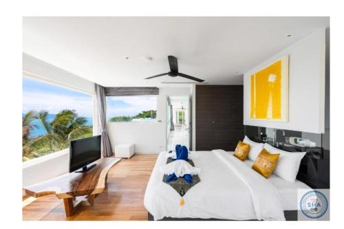 Postel nebo postele na pokoji v ubytování Panorama Samui Residences