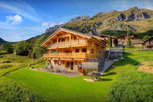 a large log house in the mountains at Chalet Crechoua - OVO Network in La Giettaz