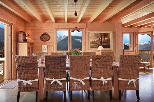 a dining room with a table and chairs at Chalet Polanka - OVO Network in Saint-Jean-de-Sixt