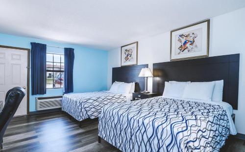Katil atau katil-katil dalam bilik di Sky-Palace Inn & Suites Wellington